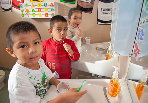 Preschool students brushing teeth
